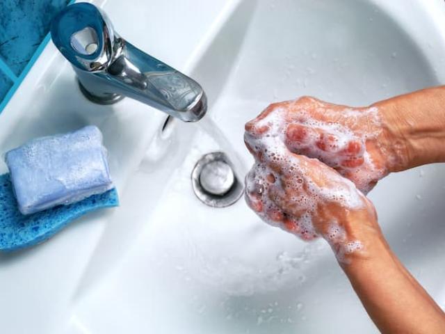 people washing their hands as part of hygiene habits